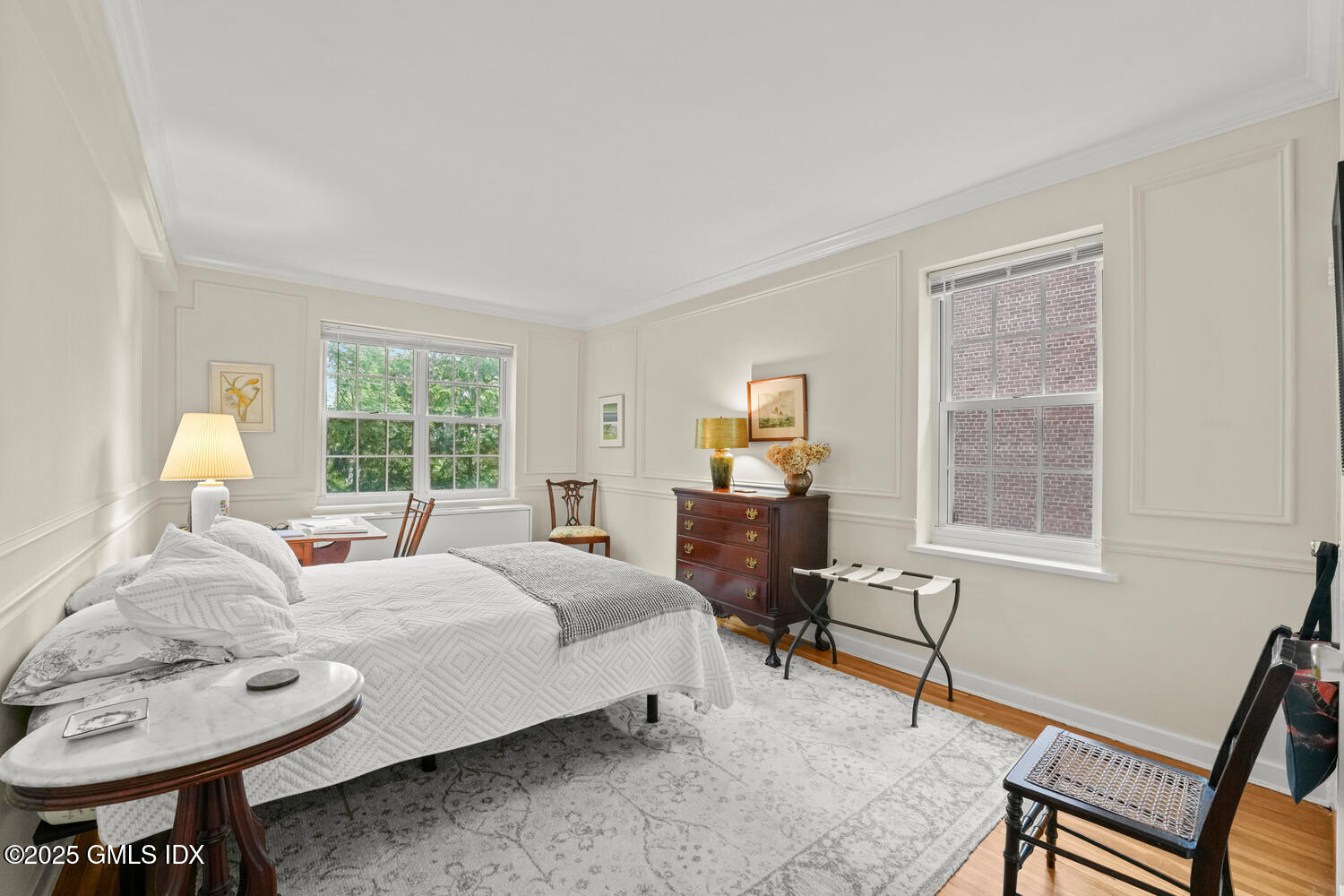 20 Church Street, Unit A34 Greenwich, CT 06830 - Photo 11 of 25 a bedroom with furniture and a window