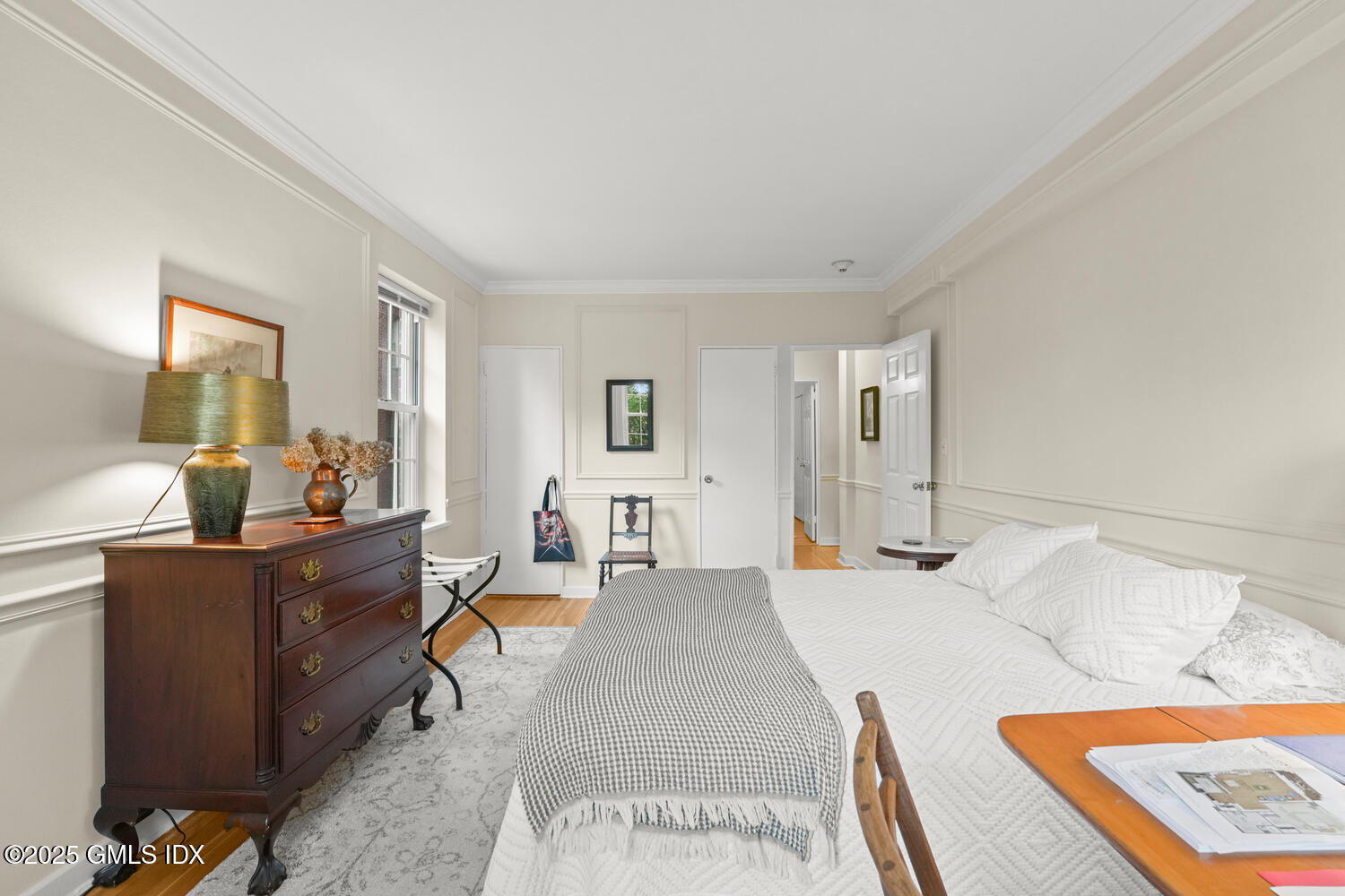20 Church Street, Unit A34 Greenwich, CT 06830 - Photo 12 of 25 a bed room with a bed furniture and a window