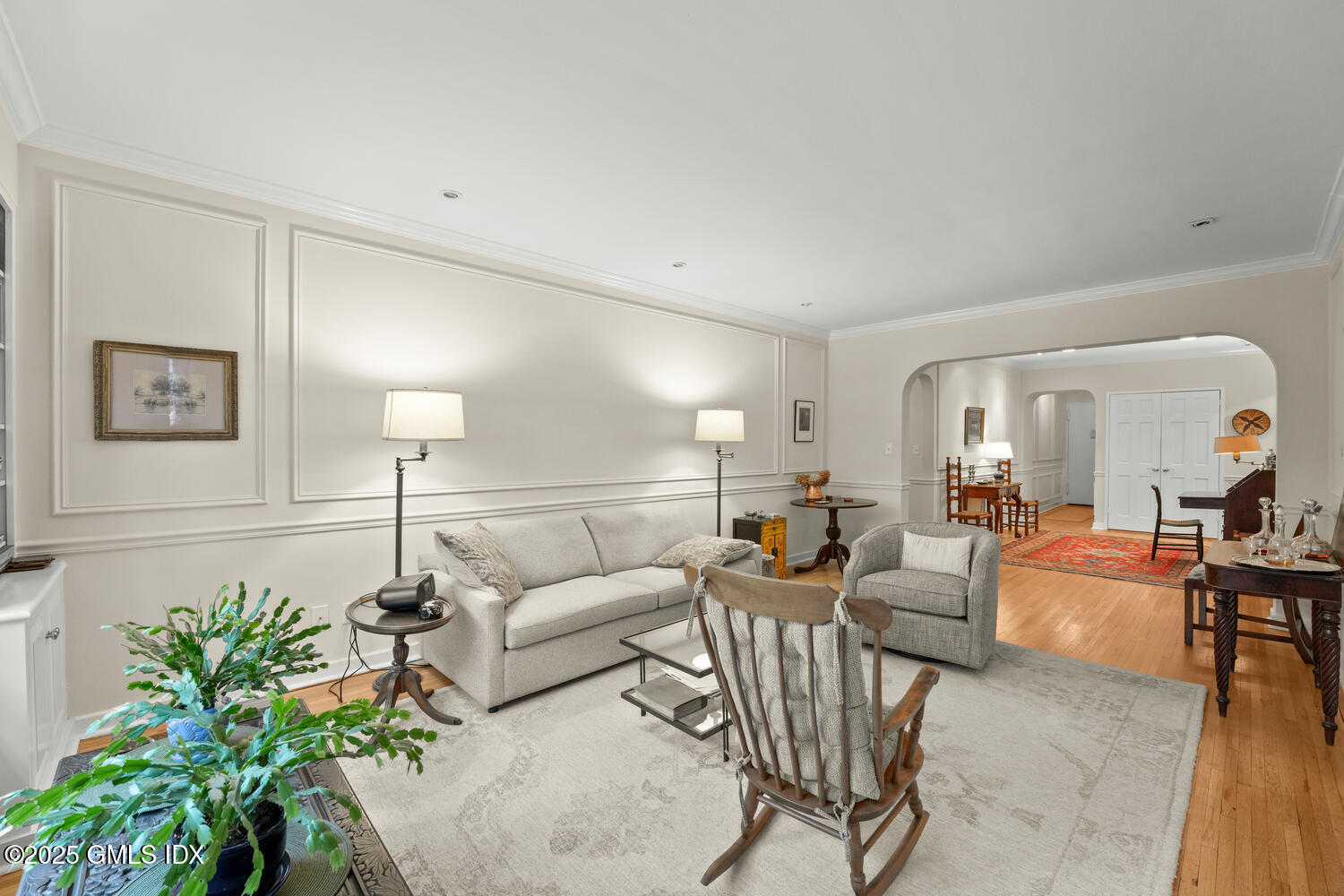 20 Church Street, Unit A34 Greenwich, CT 06830 - Photo 2 of 25 a living room with furniture and a potted plant