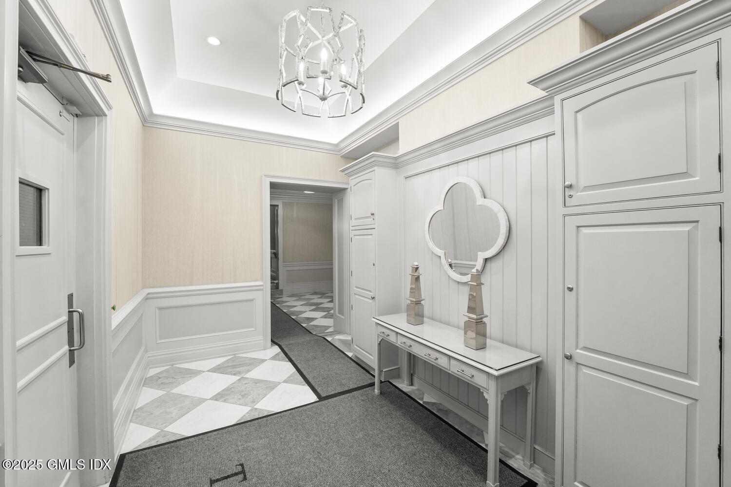20 Church Street, Unit A34 Greenwich, CT 06830 - Photo 21 of 25 a room with a chandelier