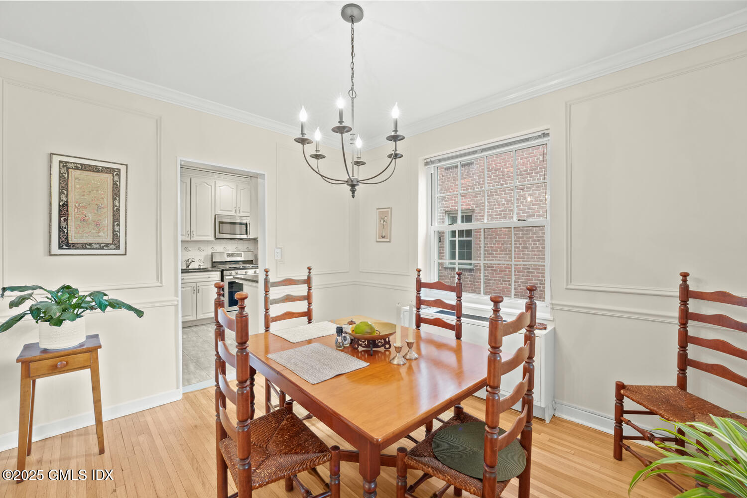 20 Church Street, Unit A34 Greenwich, CT 06830 - Photo 3 of 25 a view of a dining room with furniture window and wooden floor