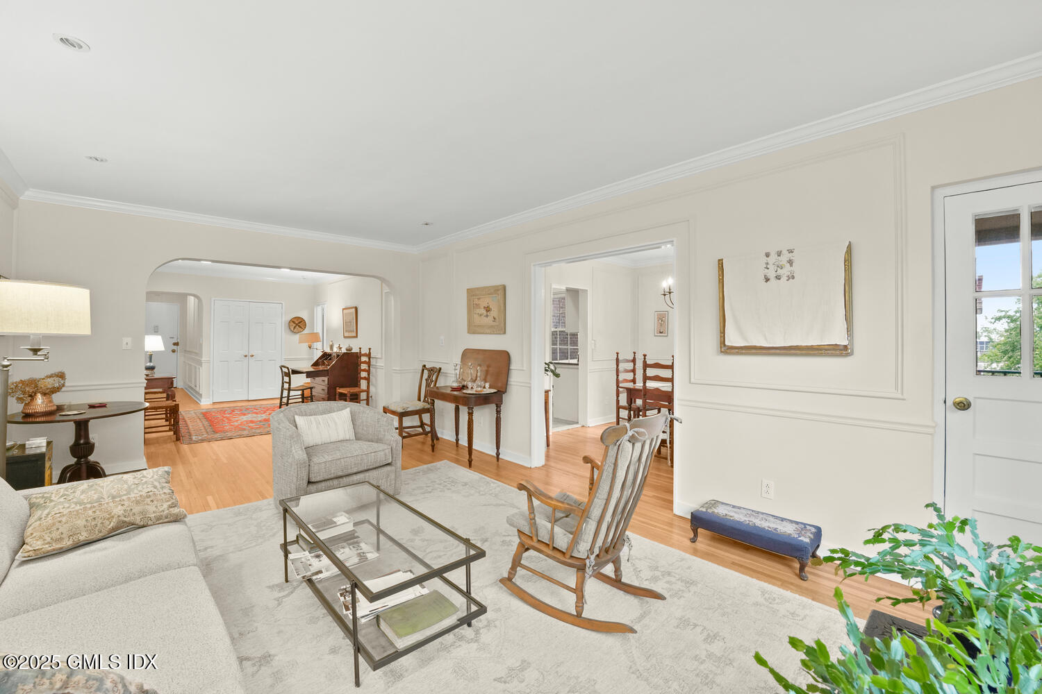 20 Church Street, Unit A34 Greenwich, CT 06830 - Photo 4 of 25 a living room with furniture a wooden floor and next to a window