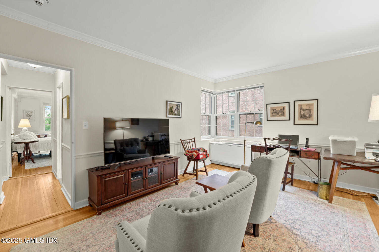 20 Church Street, Unit A34 Greenwich, CT 06830 - Photo 5 of 25 a living room with furniture and a flat screen tv
