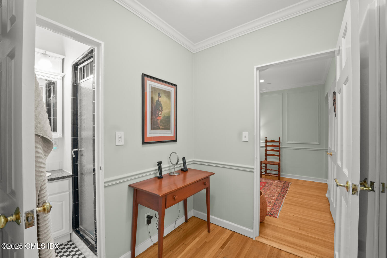 20 Church Street, Unit A34 Greenwich, CT 06830 - Photo 9 of 25 a view of a hallway with wooden floor and a bathroom