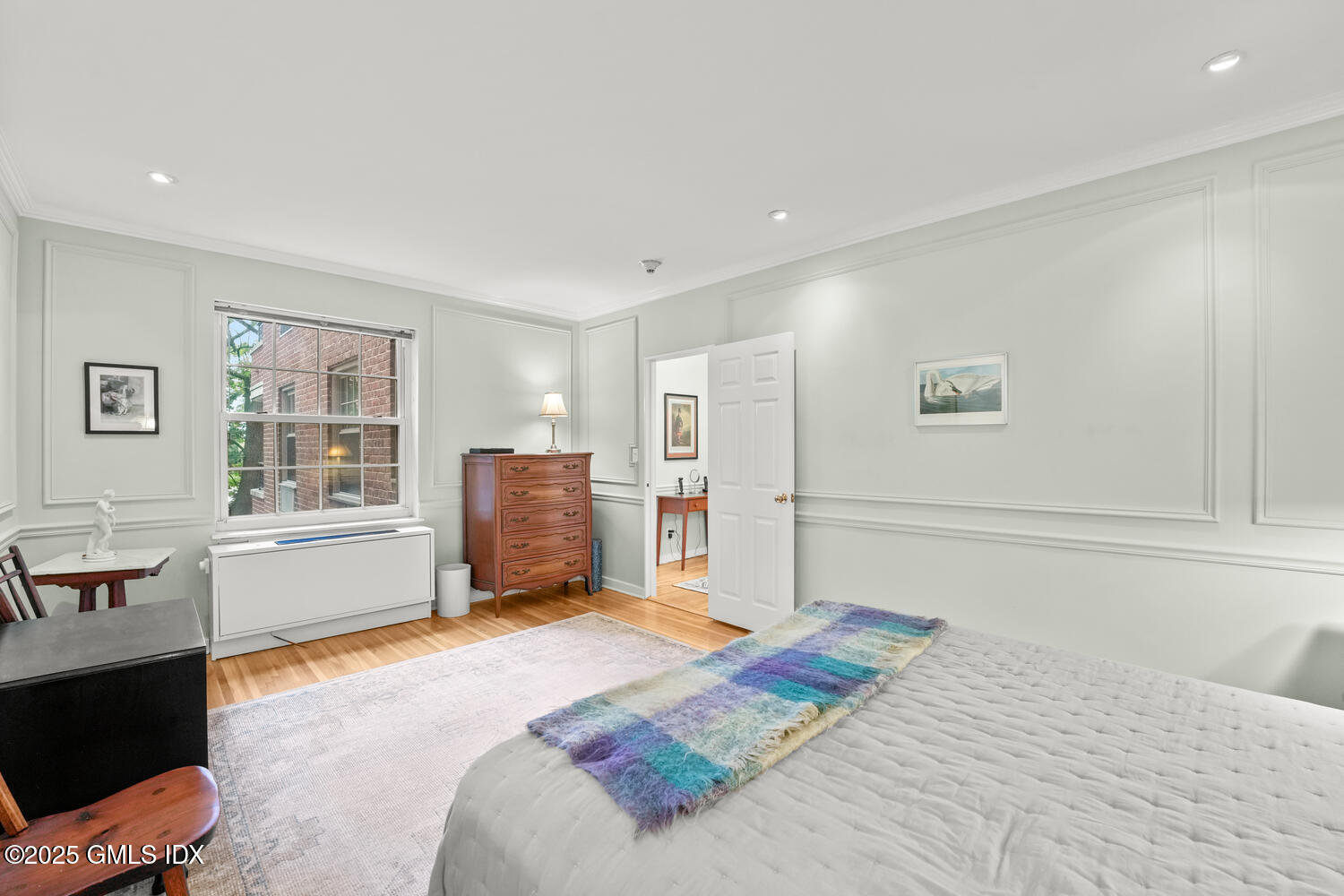 20 Church Street, Unit A34 Greenwich, CT 06830 - Photo 10 of 25 a bedroom with a bed dresser and window