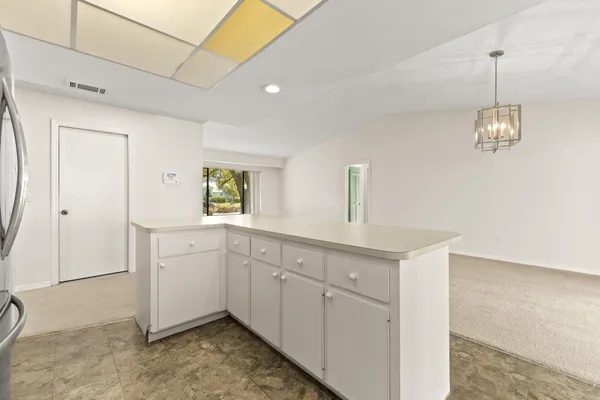 a kitchen with sink and window