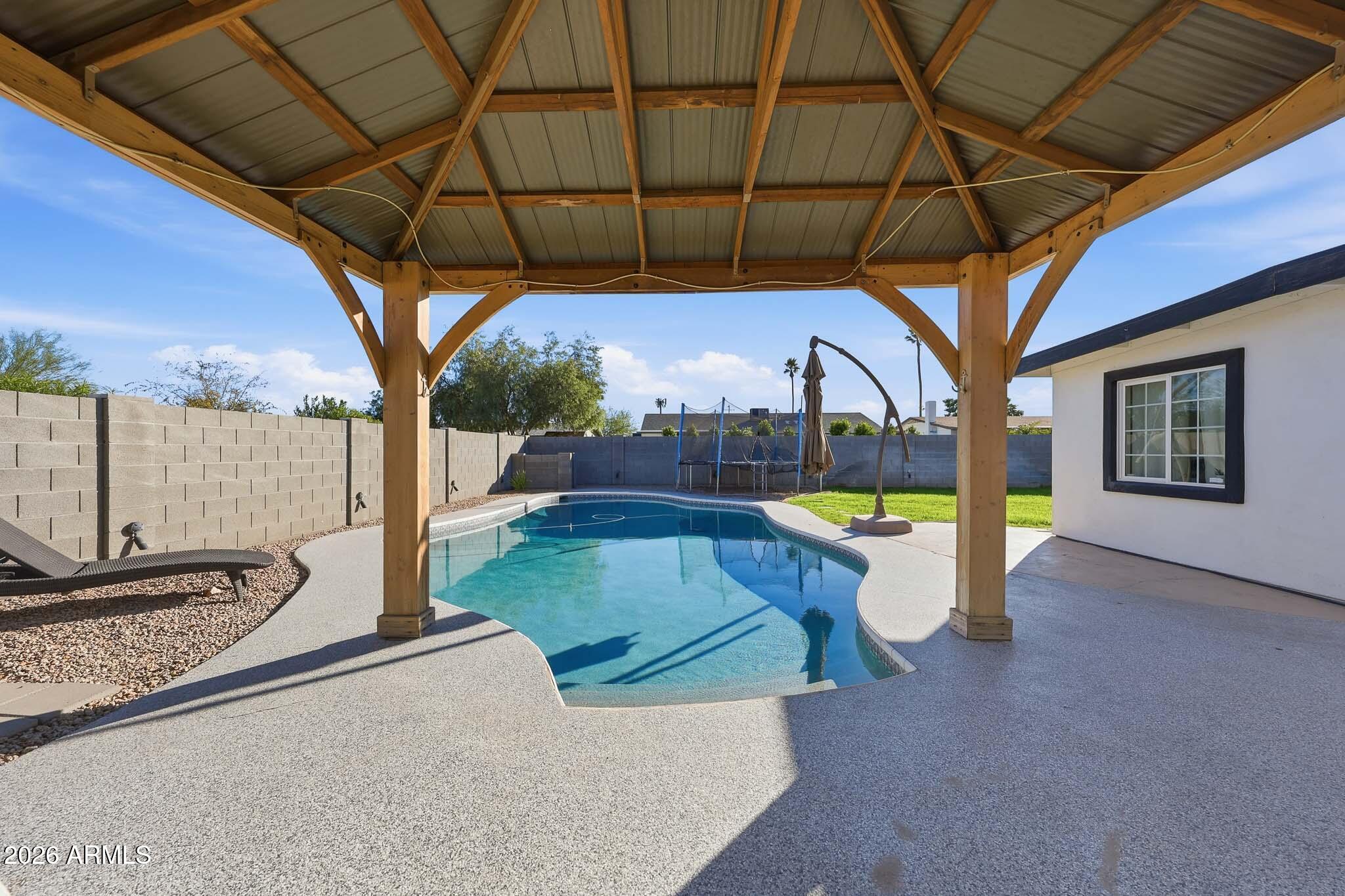 3317 East Bloomfield Road Phoenix, AZ 85032 - Photo 6 of 45 a view of a backyard with swimming pool