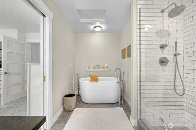 a white bath tub sitting next to a white toilet