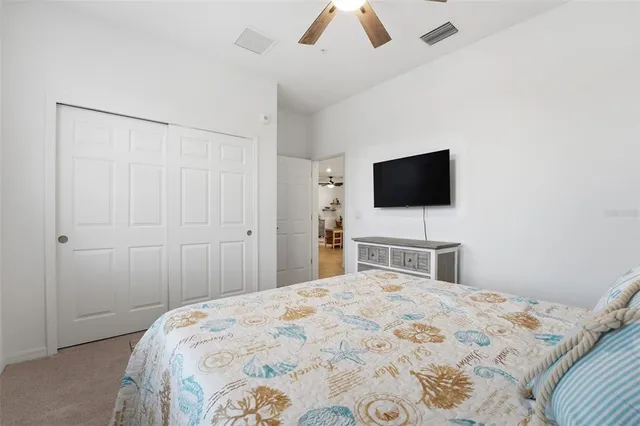 a front view of a house with a yard and a garden