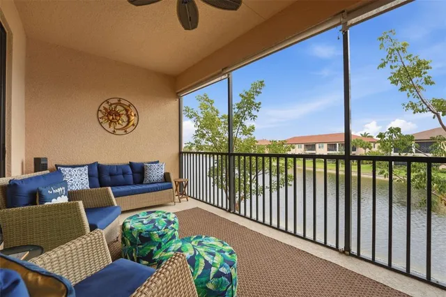 a front view of a house with a yard and potted plants