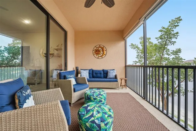 a view of a house with a yard and potted plants