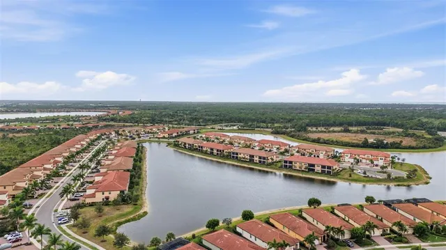a view of a workspace with furniture and a flat screen tv