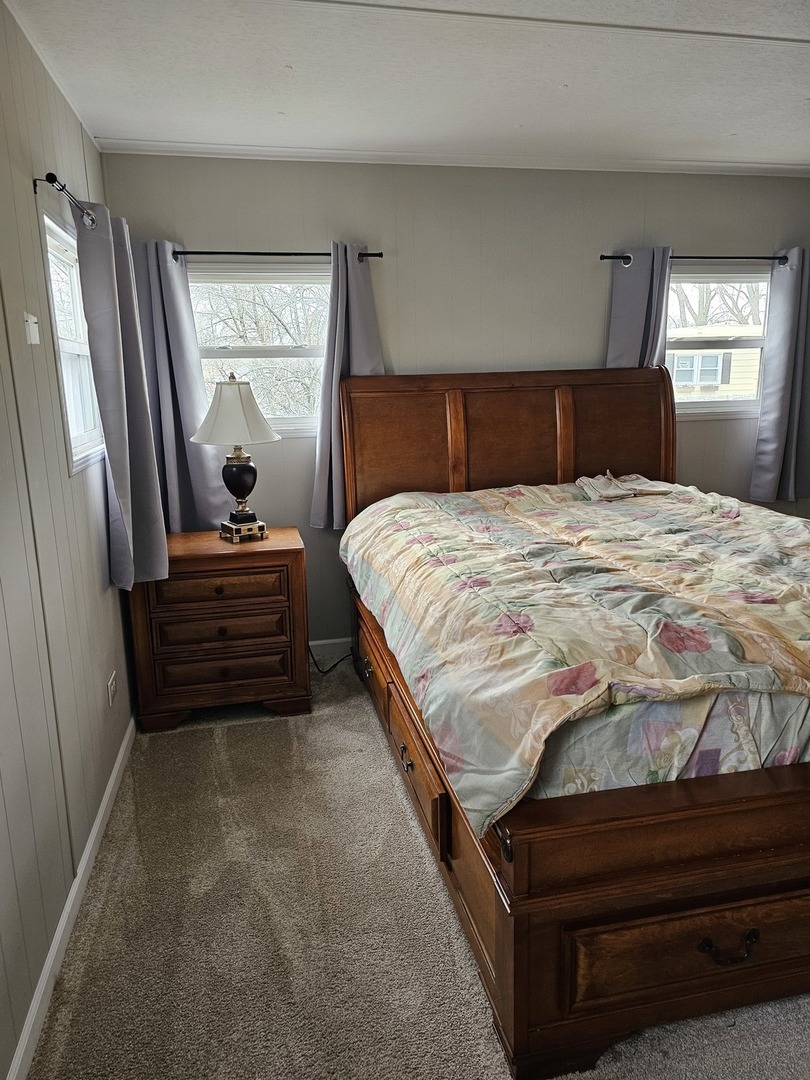 241 Little Peninsula Road Elgin, IL 60123 - Photo 13 of 20 a bedroom with a bed and window