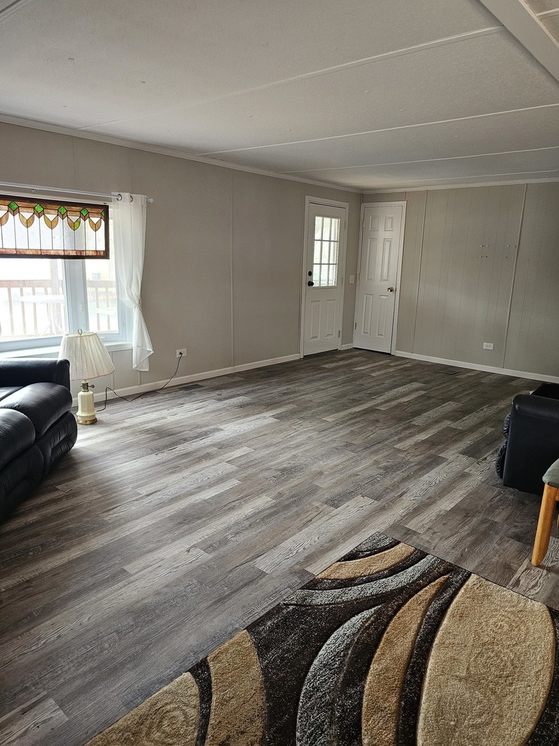 241 Little Peninsula Road Elgin, IL 60123 - Photo 9 of 20 a view of a bedroom with furniture and windows