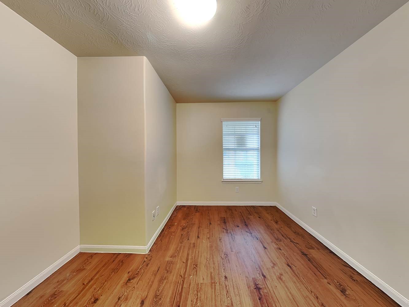 3719 Iris Ridge Way Fresno, TX 77545 - Photo 13 of 16 an empty room with wooden floor and windows