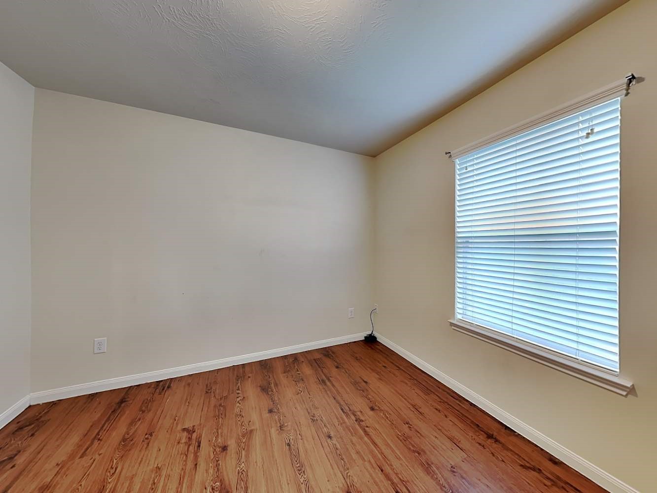 3719 Iris Ridge Way Fresno, TX 77545 - Photo 14 of 16 a view of a room with wooden floor and a window
