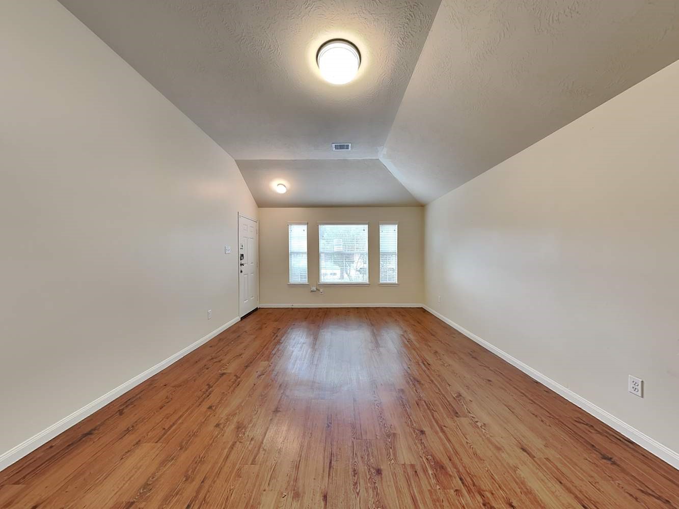 3719 Iris Ridge Way Fresno, TX 77545 - Photo 4 of 16 an empty room with wooden floor and windows