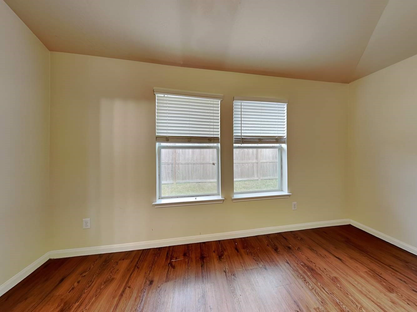 3719 Iris Ridge Way Fresno, TX 77545 - Photo 10 of 16 an empty room with wooden floor and windows
