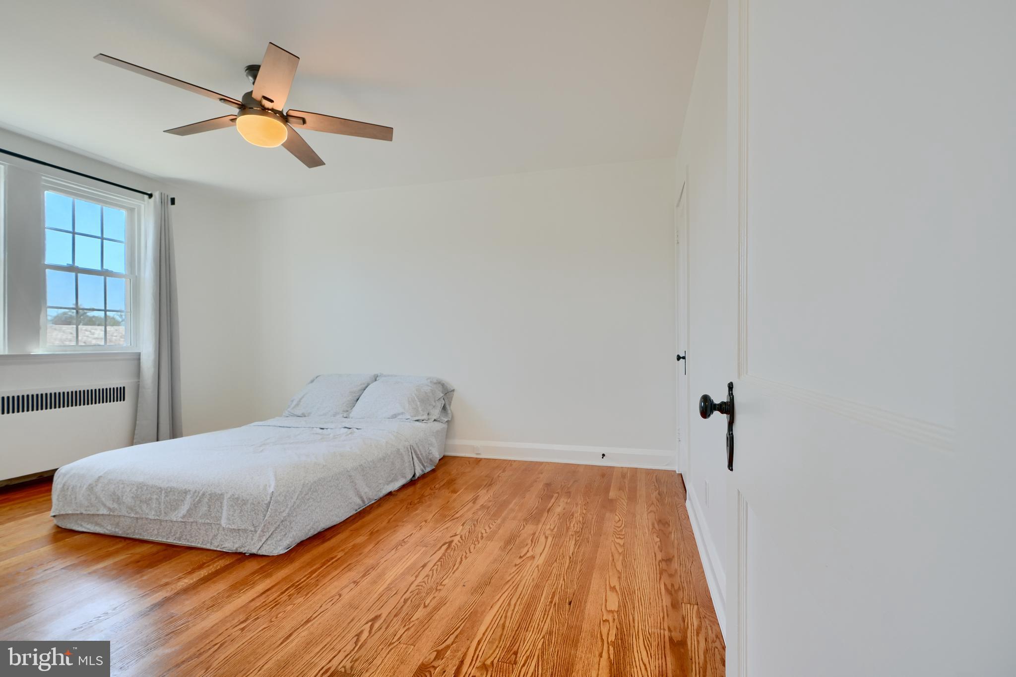 428 Overbrook Road Baltimore, MD 21228 - Photo 29 of 59 a bedroom with a bed and a window
