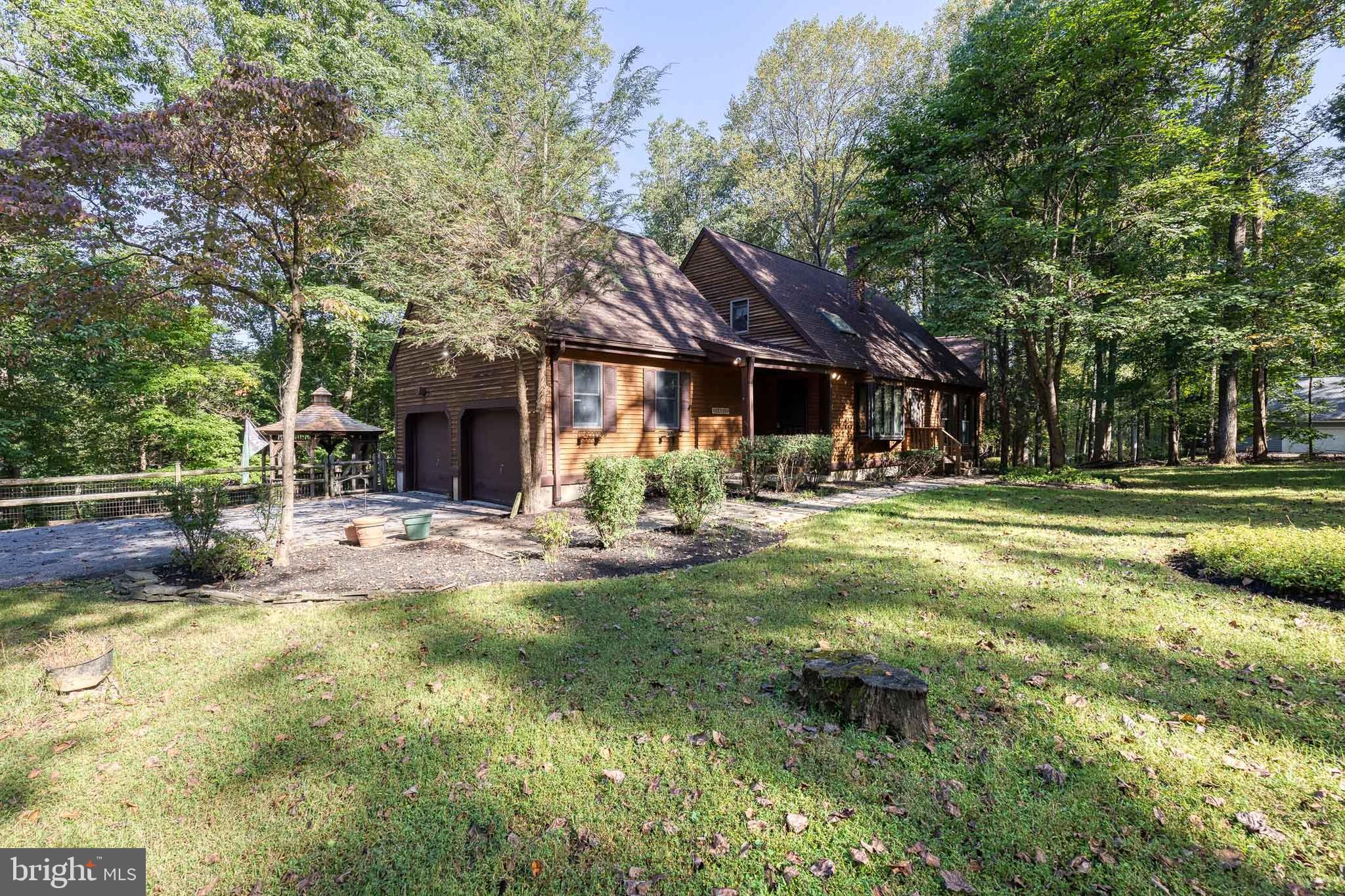 12610 Timber Grove Road Reisterstown, MD 21136 - Photo 2 of 39 a view of a house with swimming pool and sitting area