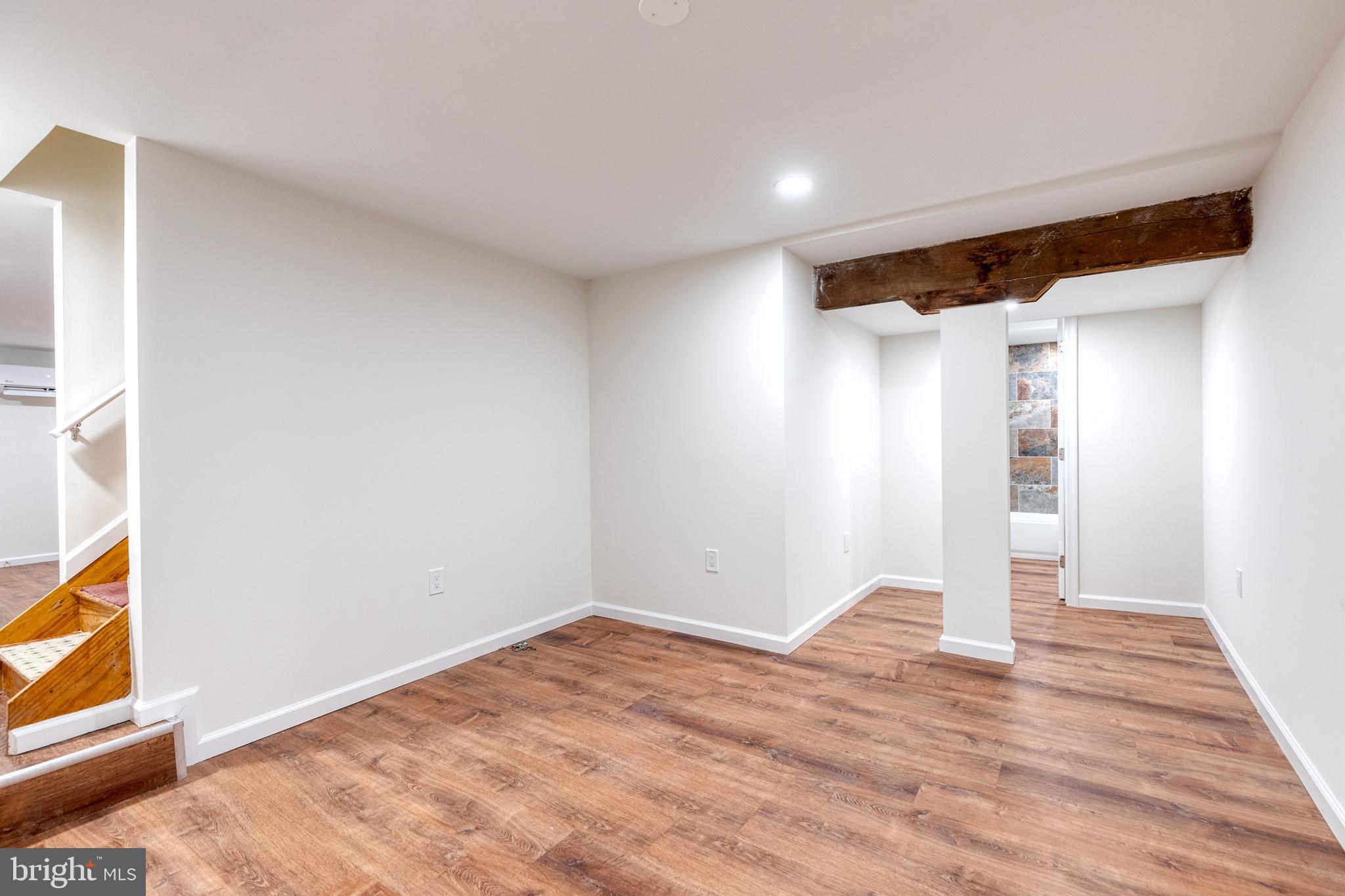 12610 Timber Grove Road Reisterstown, MD 21136 - Photo 25 of 39 a view of empty room with wooden floor