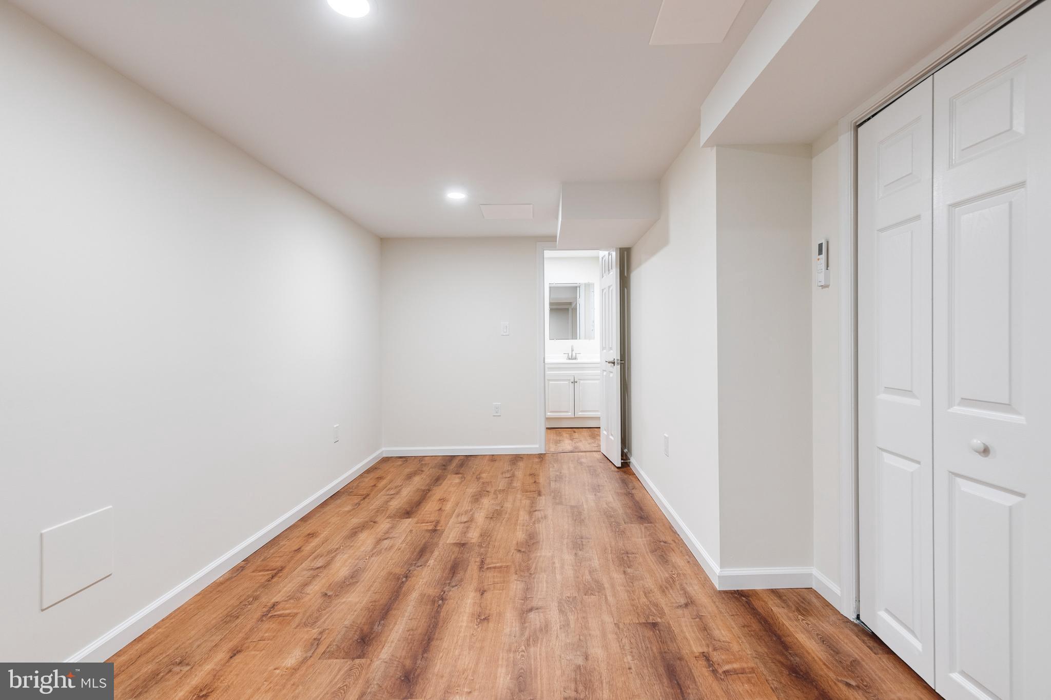12610 Timber Grove Road Reisterstown, MD 21136 - Photo 26 of 39 a view of a room with wooden floor