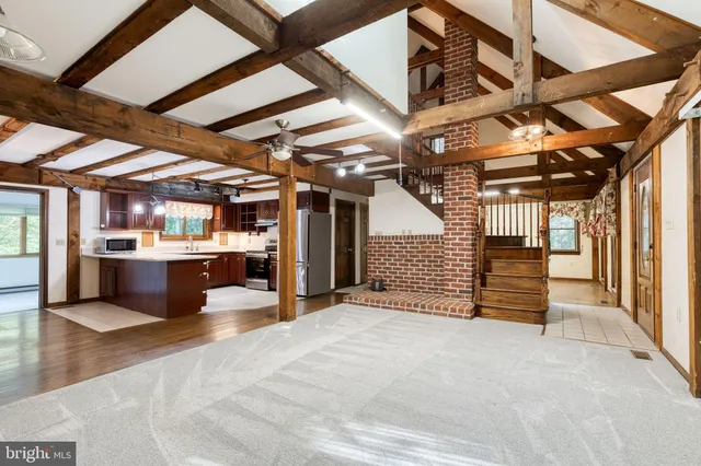 a view of a room with wooden walls