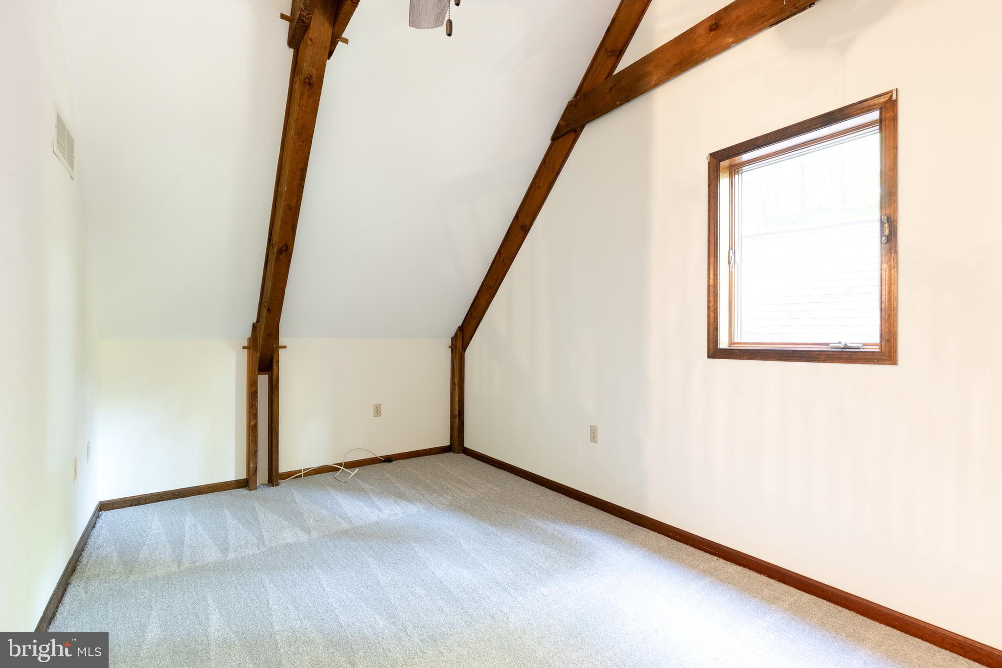 12610 Timber Grove Road Reisterstown, MD 21136 - Photo 32 of 39 an empty room with wooden floor and windows