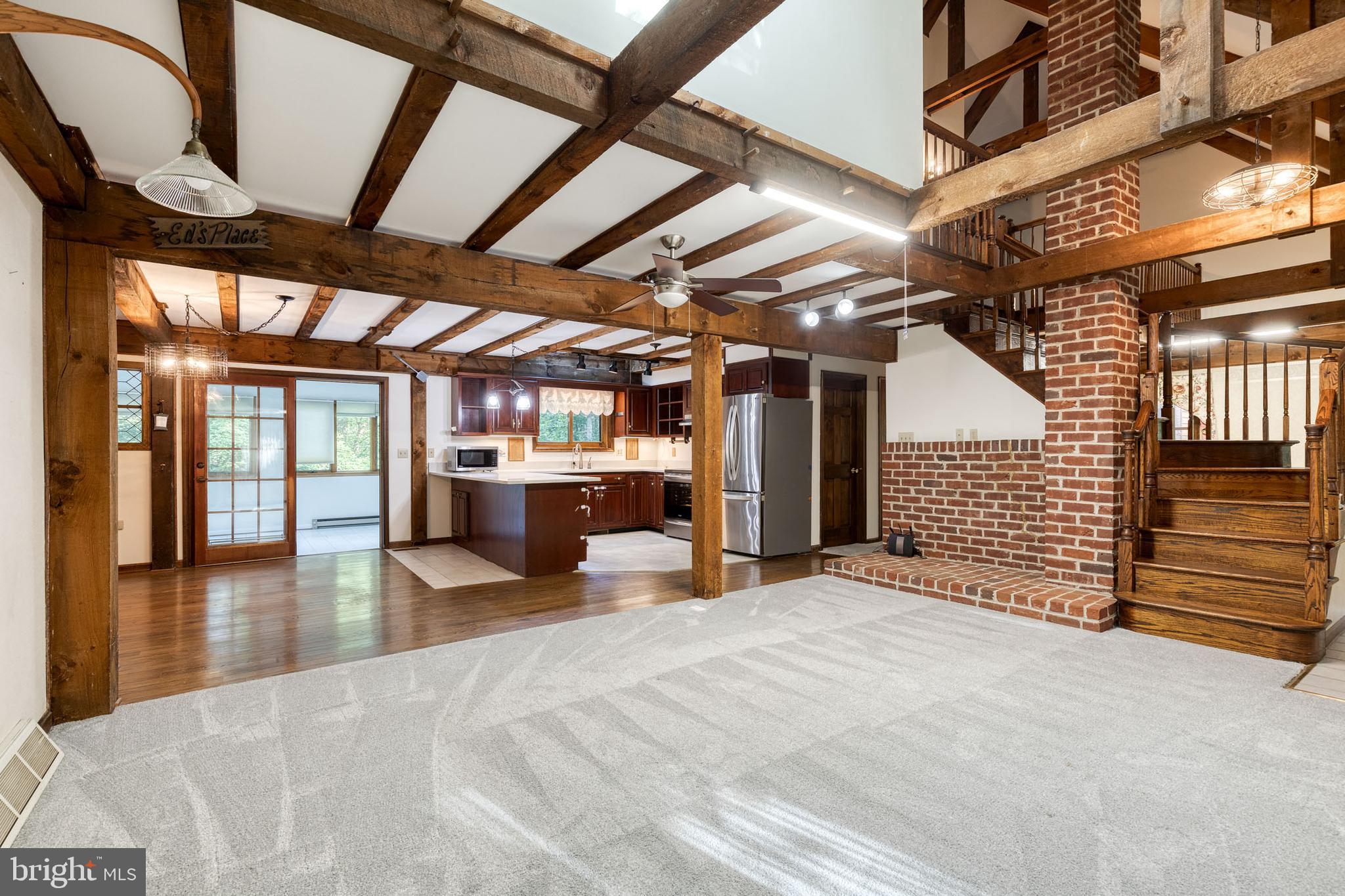 12610 Timber Grove Road Reisterstown, MD 21136 - Photo 4 of 39 a view of a hall with an empty room