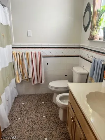 a bathroom with a toilet and a sink