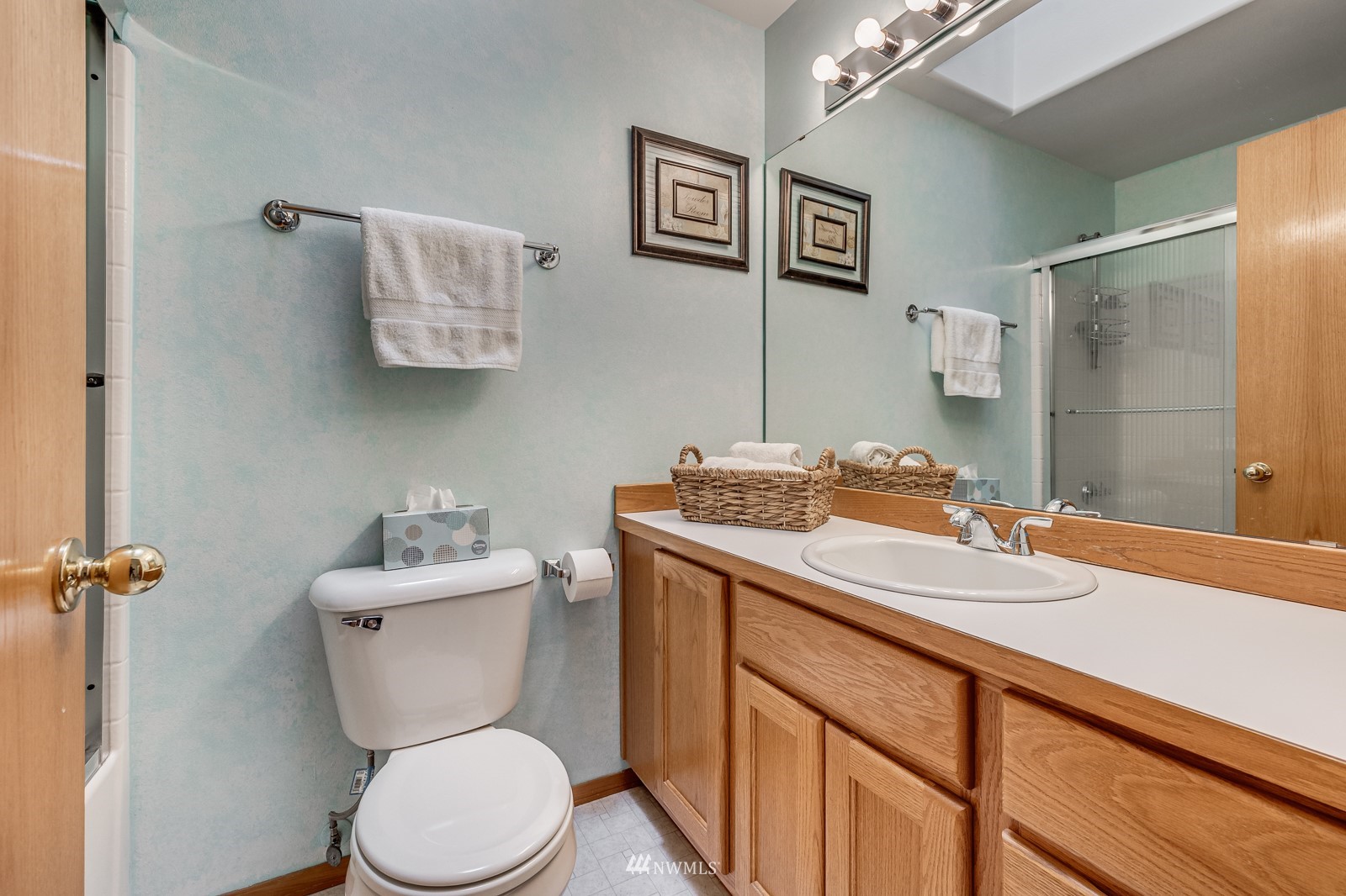 5531 East Wishon Road Snohomish, WA 98290 - Photo 17 of 36 a bathroom with a granite countertop sink mirror vanity and toilet
