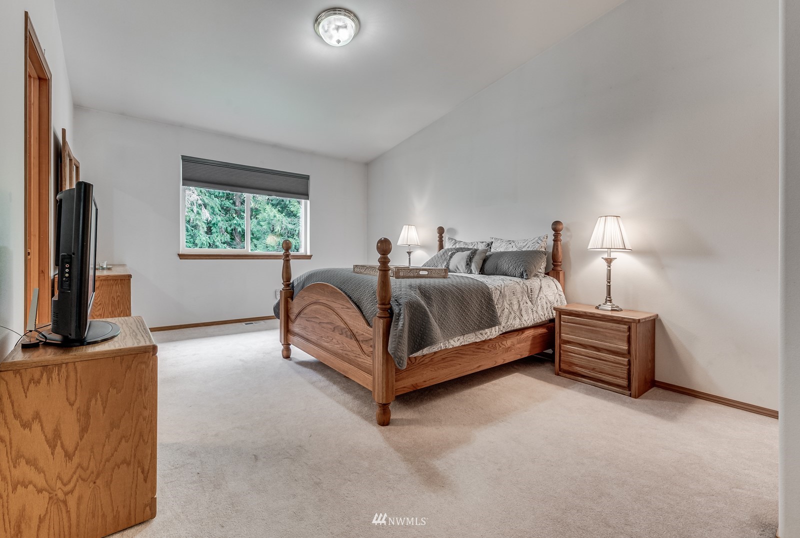 5531 East Wishon Road Snohomish, WA 98290 - Photo 20 of 36 a spacious bedroom with a bed and a flat screen television
