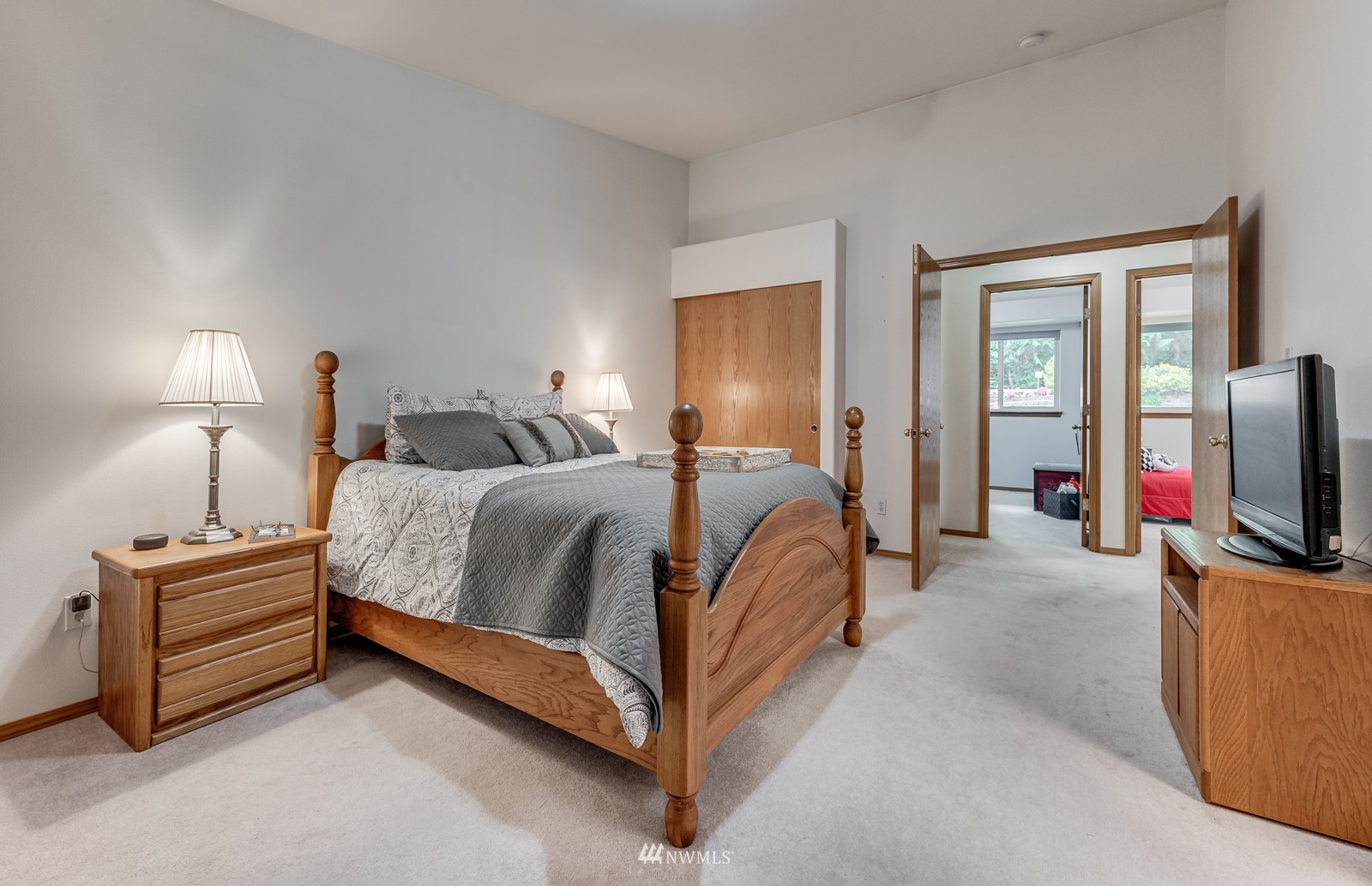 5531 East Wishon Road Snohomish, WA 98290 - Photo 21 of 36 a bedroom with bed and flat tv screen on the dresser