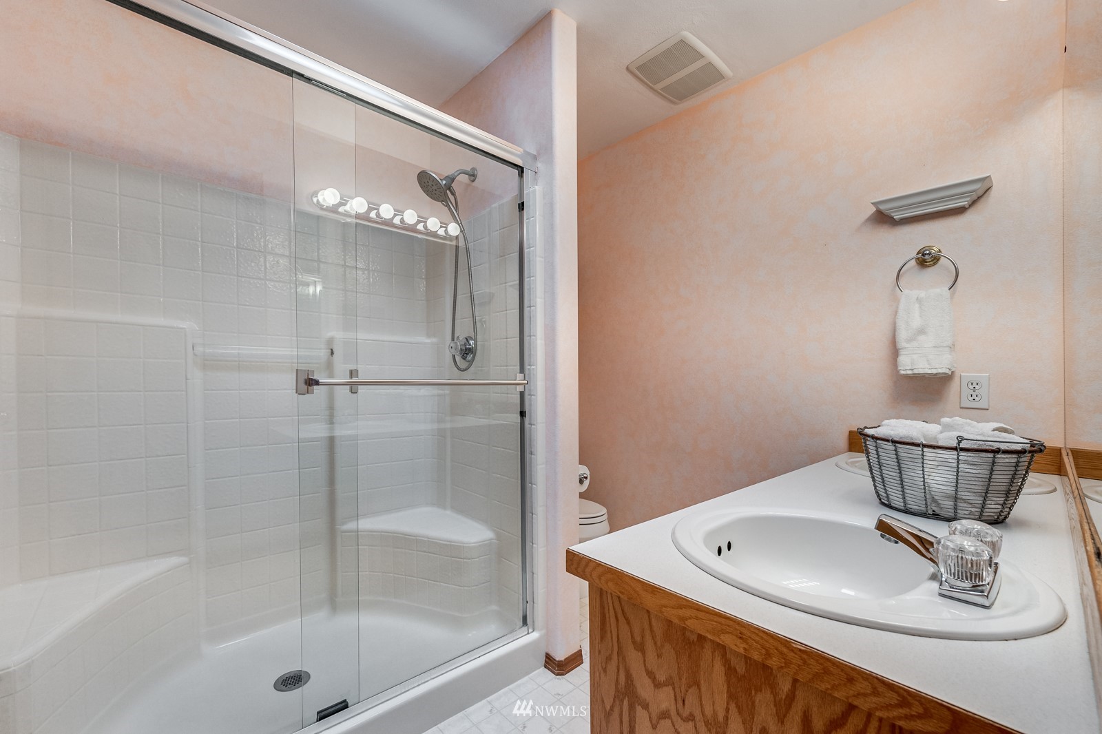 5531 East Wishon Road Snohomish, WA 98290 - Photo 22 of 36 a bathroom with a shower a sink and a mirror