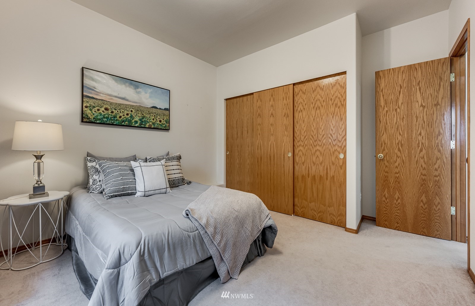 5531 East Wishon Road Snohomish, WA 98290 - Photo 30 of 36 a bedroom with a bed and a painting on the wall