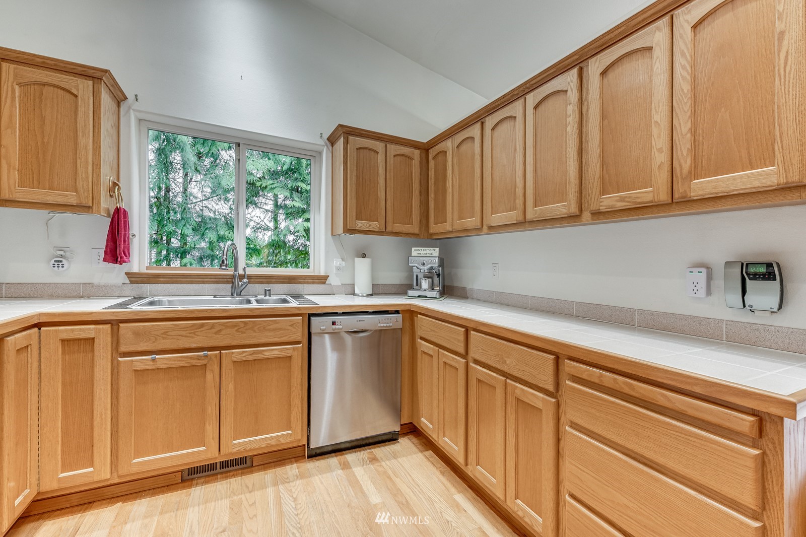 5531 East Wishon Road Snohomish, WA 98290 - Photo 9 of 36 a kitchen with granite countertop white cabinets sink and window
