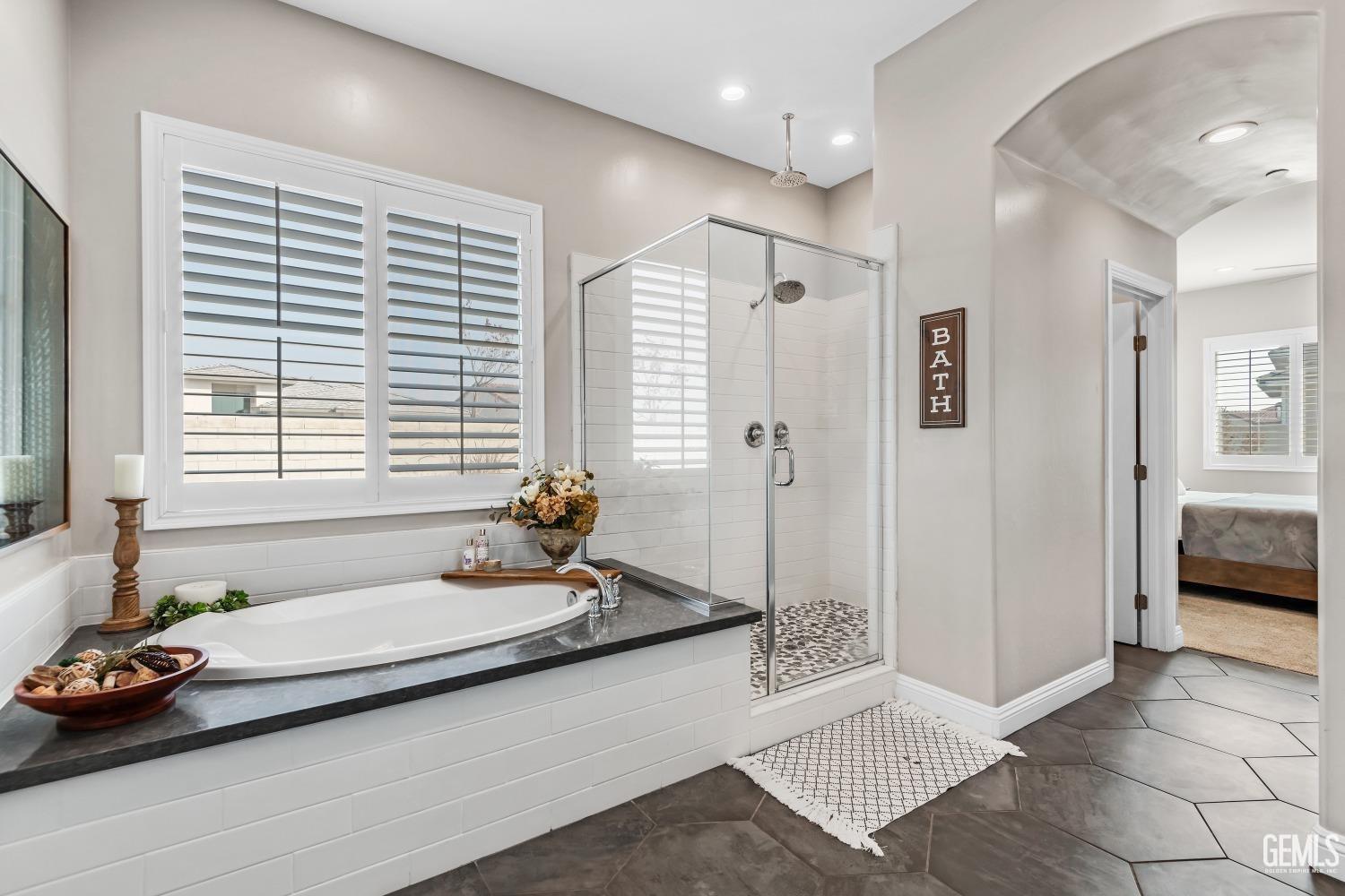 Undisclosed Address Bakersfield, CA 93311 - Photo 36 of 52 a spacious bedroom with a bed and a window