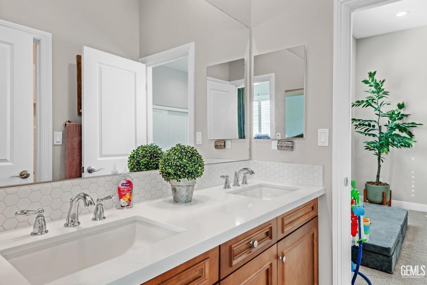 Undisclosed Address Bakersfield, CA 93311 - Photo 39 of 52 a bathroom with a sink and a mirror