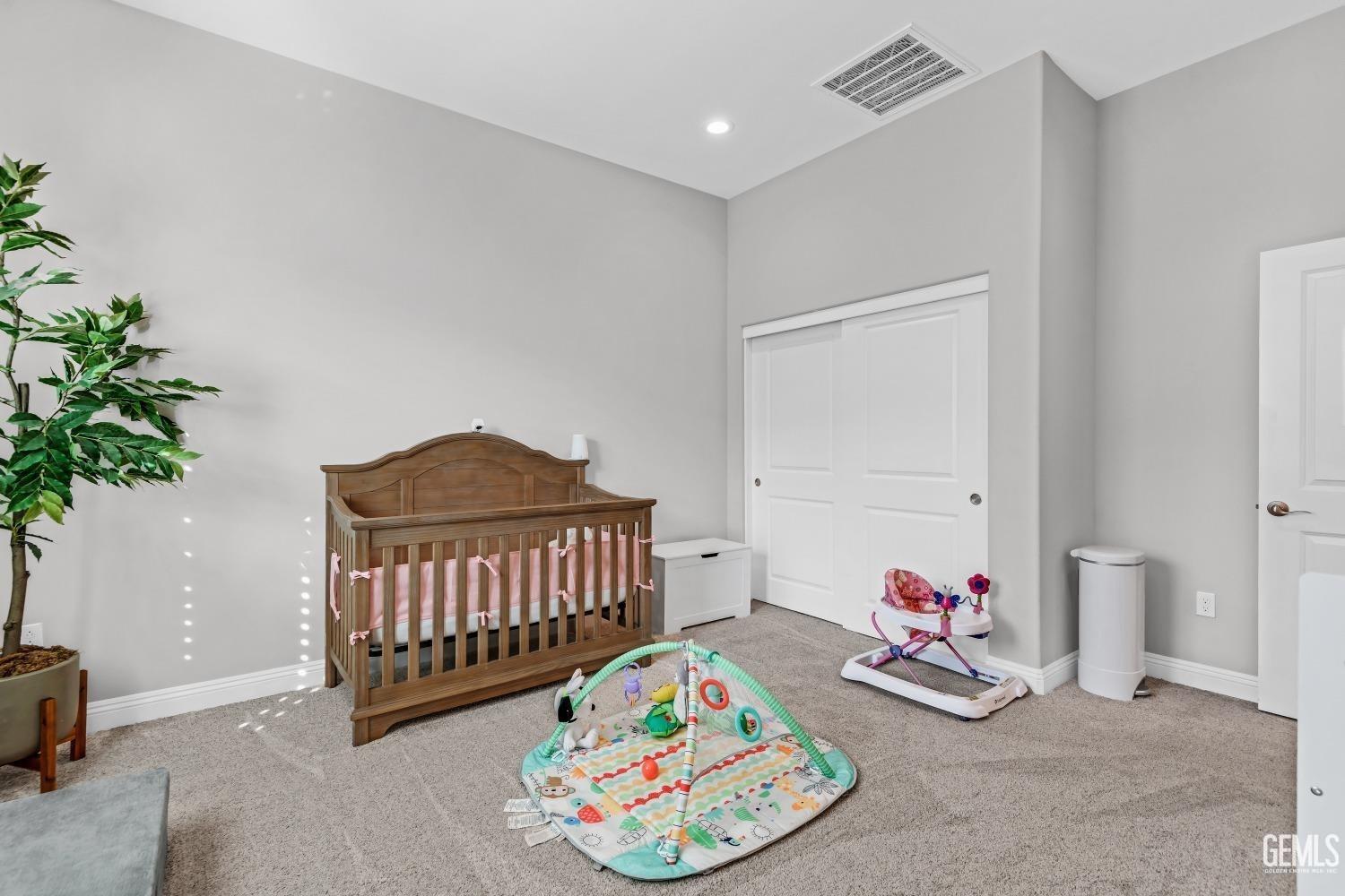 Undisclosed Address Bakersfield, CA 93311 - Photo 42 of 52 a bedroom with furniture and a potted plant