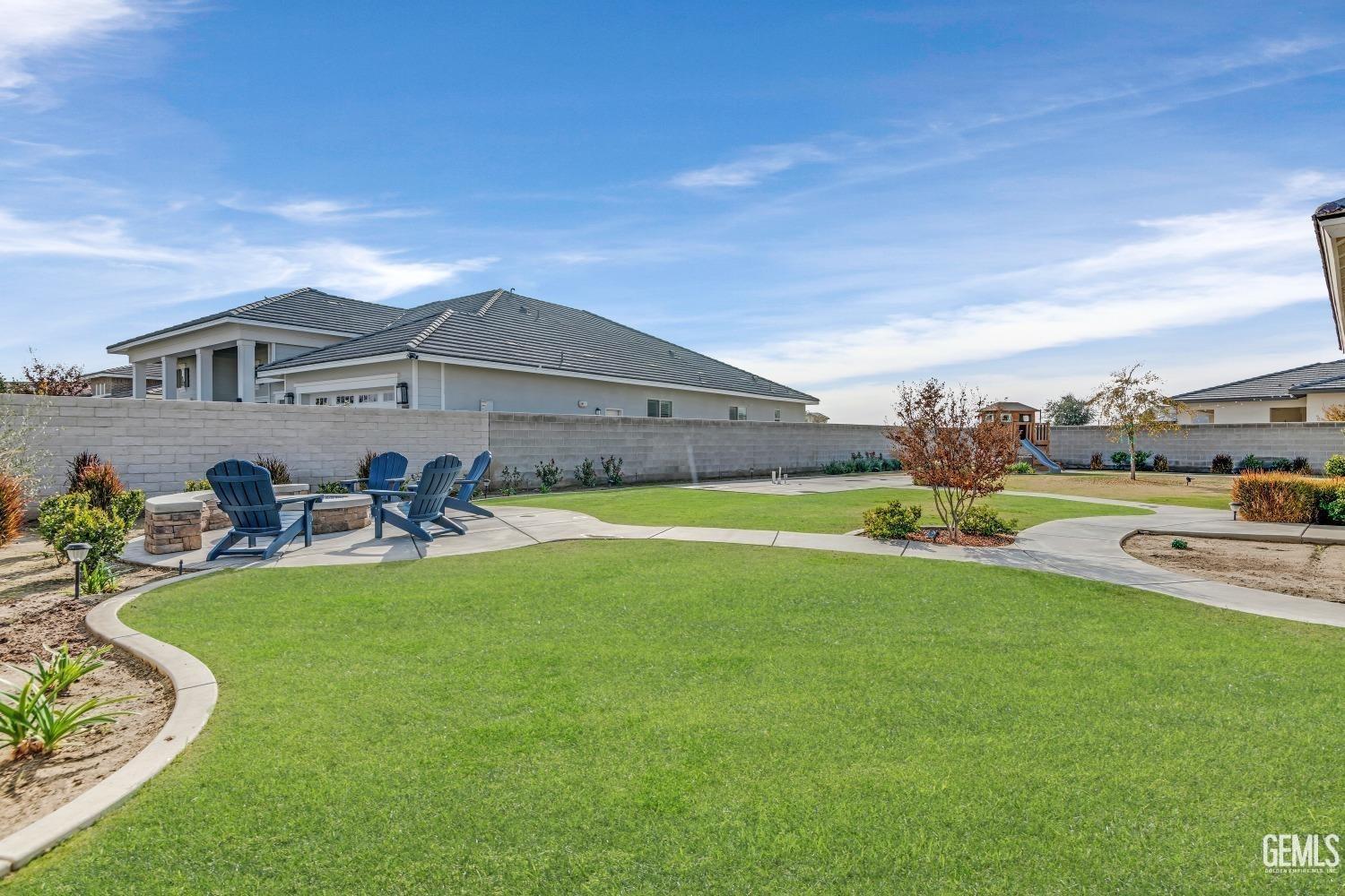 Undisclosed Address Bakersfield, CA 93311 - Photo 50 of 52 a view of a house with swimming pool and a yard