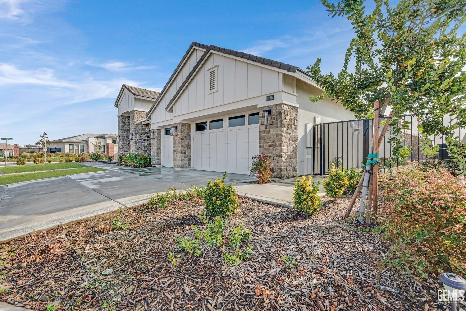 Undisclosed Address Bakersfield, CA 93311 - Photo 5 of 52 a view of a house with a yard and large tree