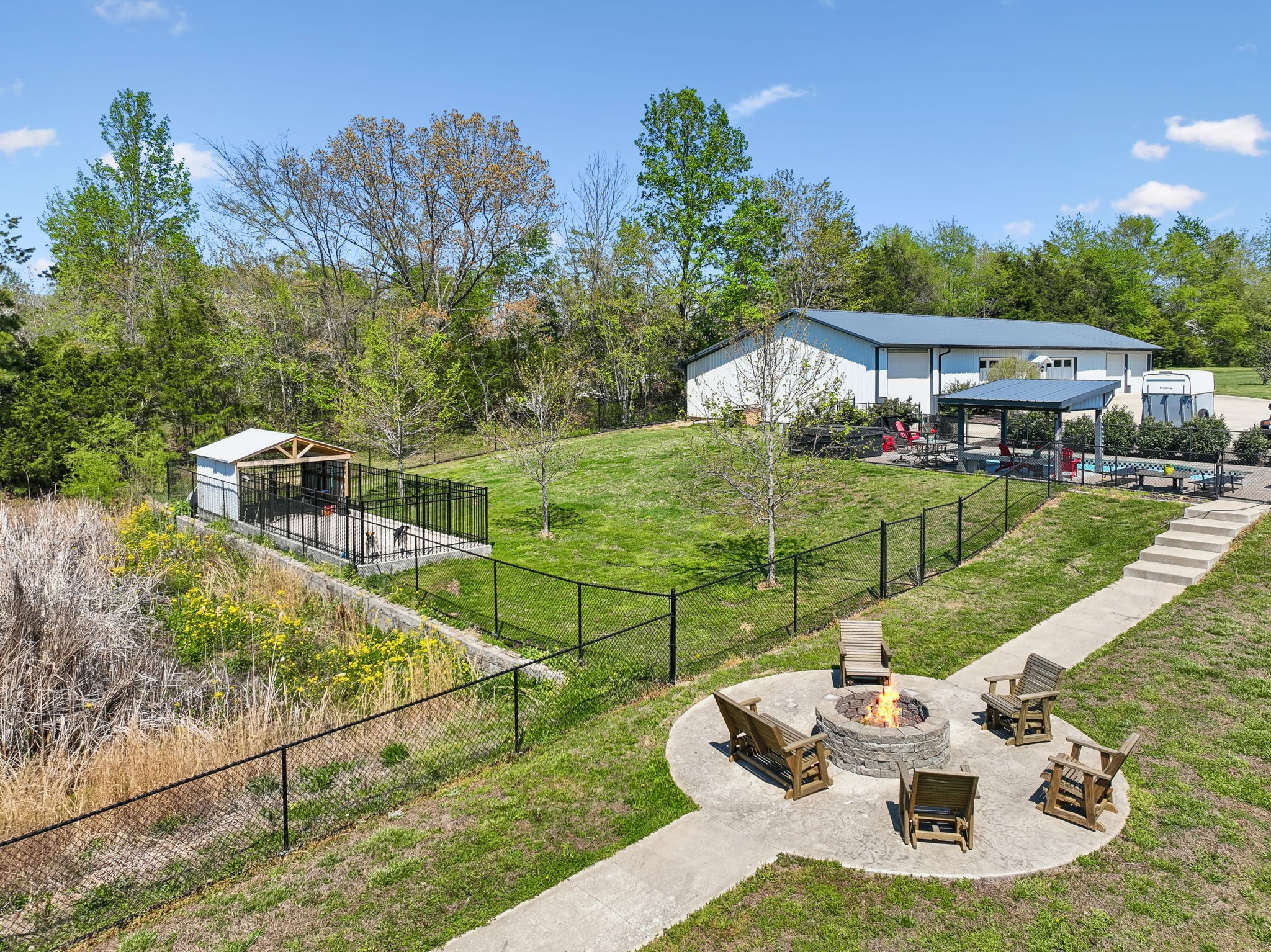 3010 Spencer Mill Road Bon Aqua, TN 37025 - Photo 84 of 100 a view of a chairs and table in the backyard