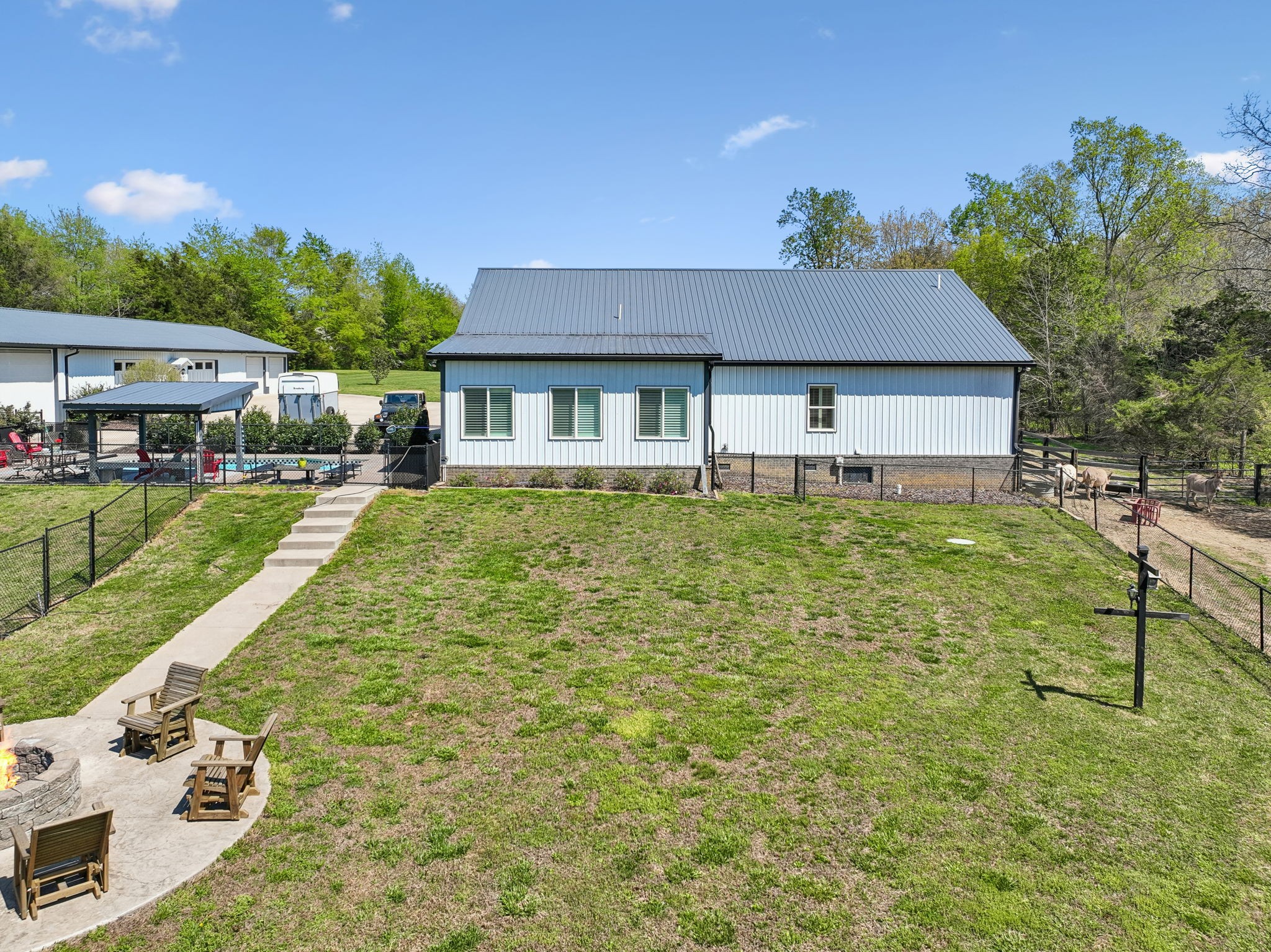 3010 Spencer Mill Road Bon Aqua, TN 37025 - Photo 85 of 100 a view of a house with a yard porch and sitting area