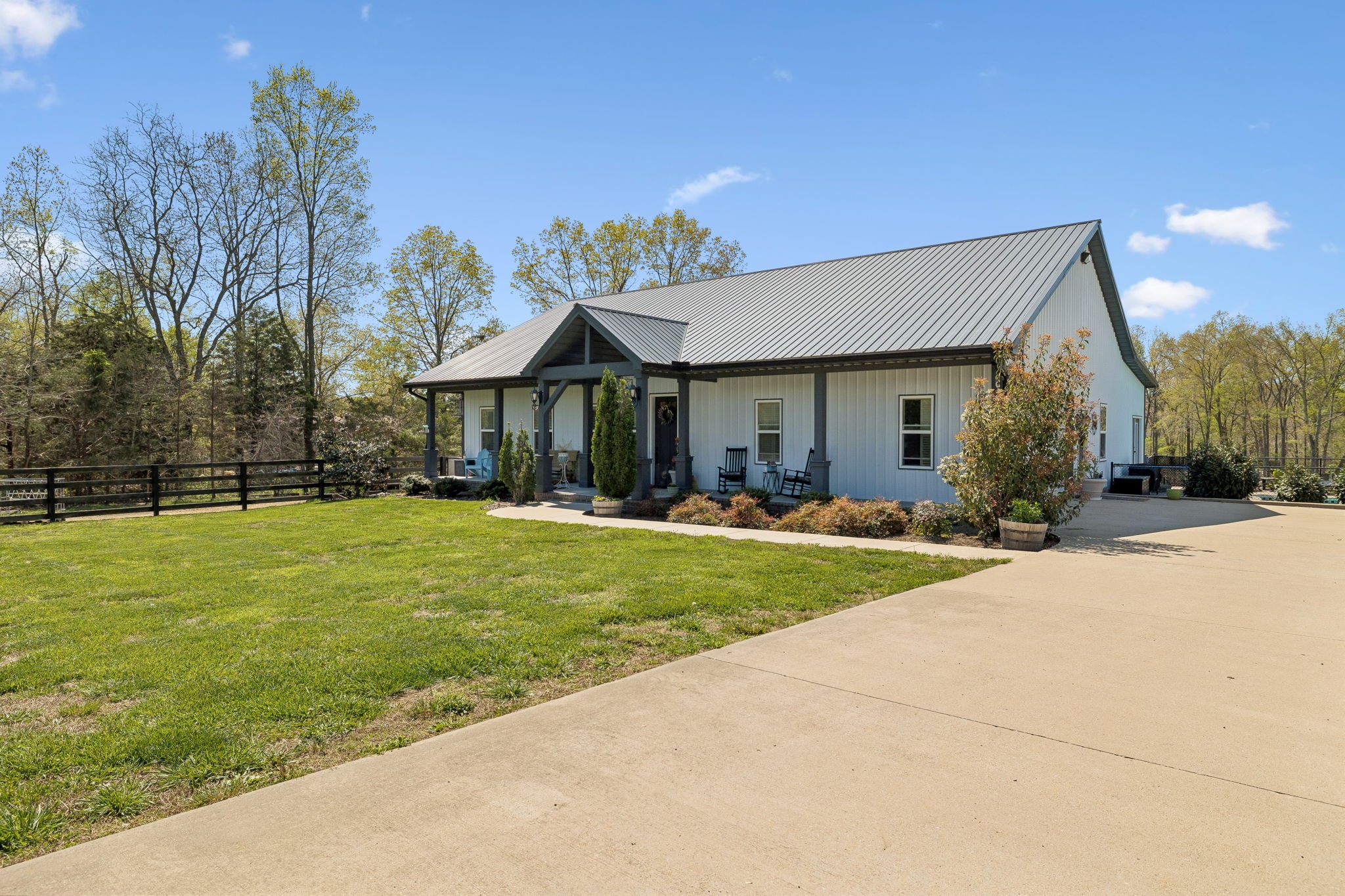 3010 Spencer Mill Road Bon Aqua, TN 37025 - Photo 89 of 100 a front view of a house with a yard