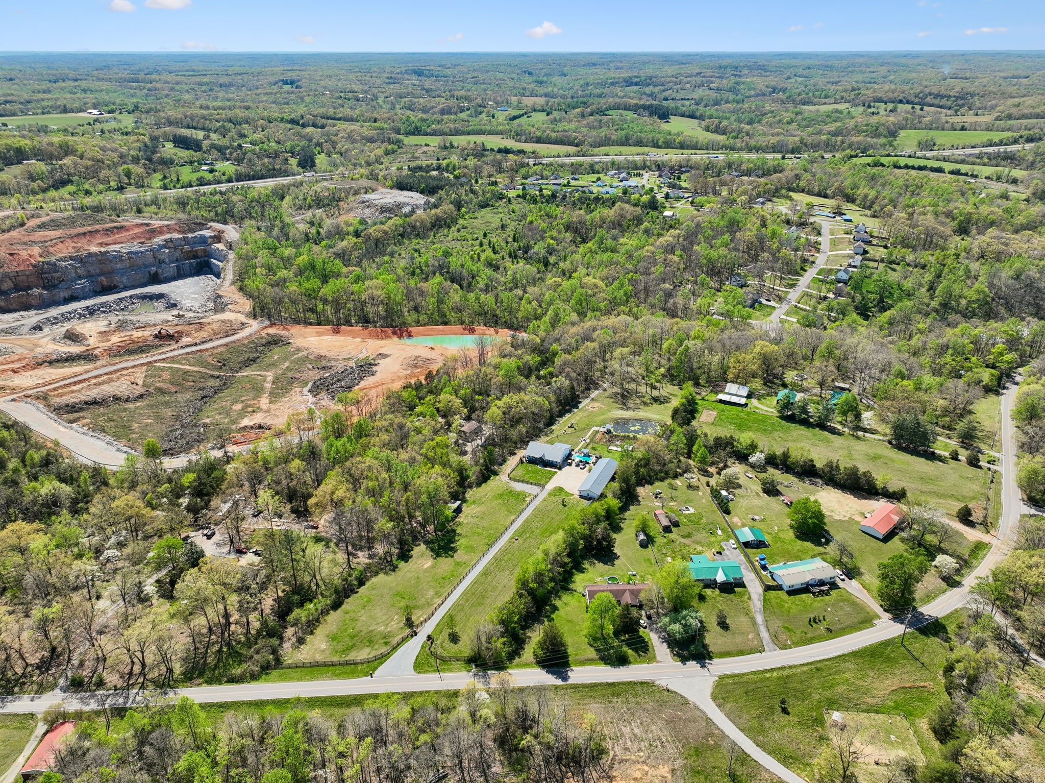 3010 Spencer Mill Road Bon Aqua, TN 37025 - Photo 100 of 100 an aerial view of residential houses with outdoor space and trees
