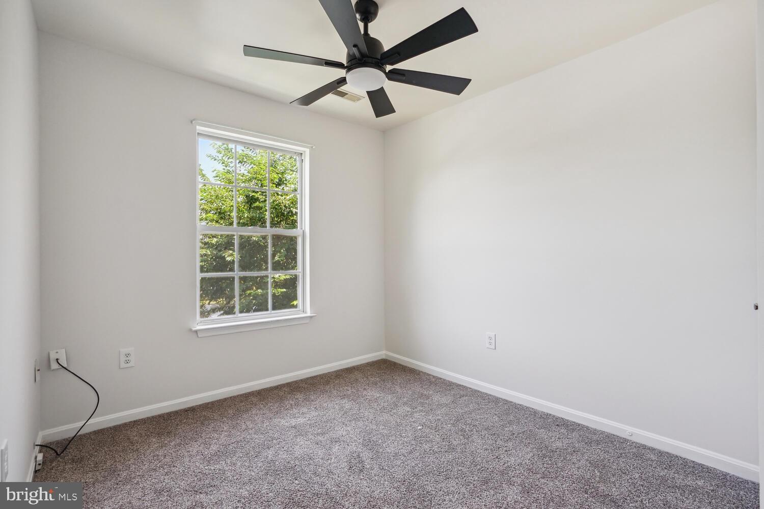 9205 Ridgefield Circle Frederick, MD 21701 - Photo 12 of 19 an empty room with a window and a fan