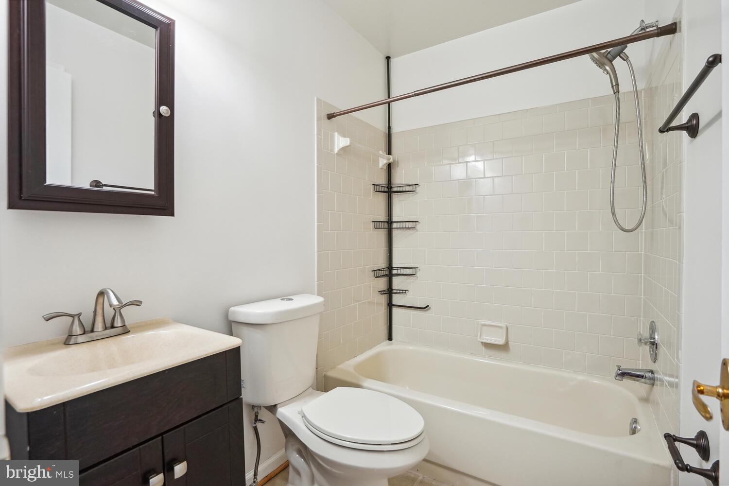 9205 Ridgefield Circle Frederick, MD 21701 - Photo 13 of 19 a bathroom with a sink toilet and shower