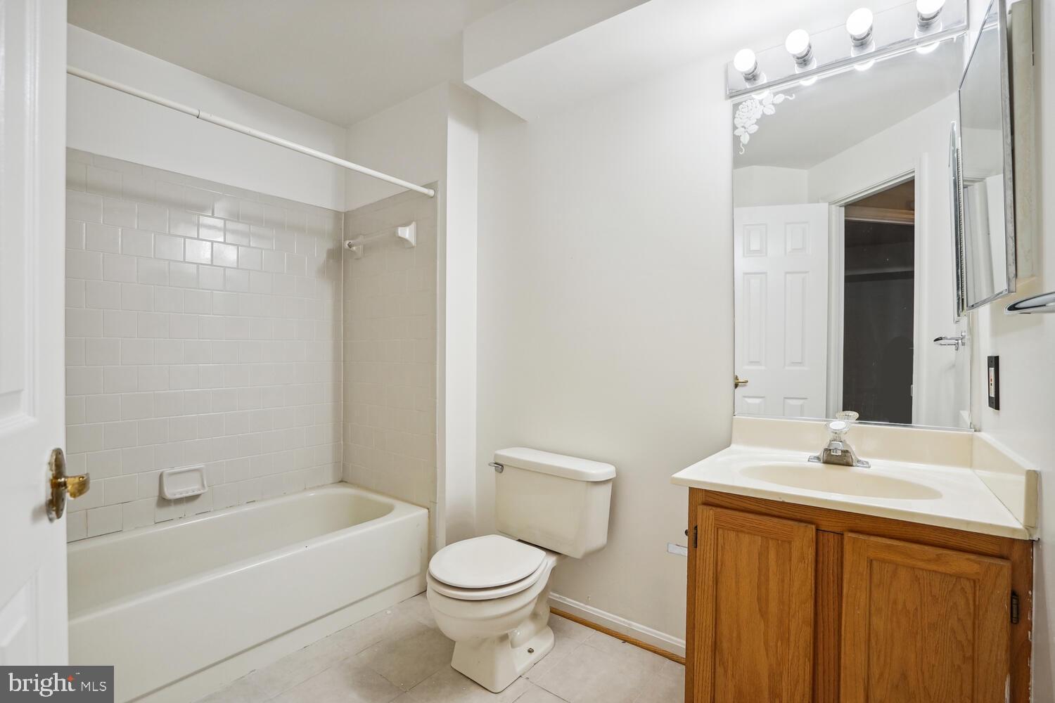9205 Ridgefield Circle Frederick, MD 21701 - Photo 16 of 19 a bathroom with a sink a toilet and shower