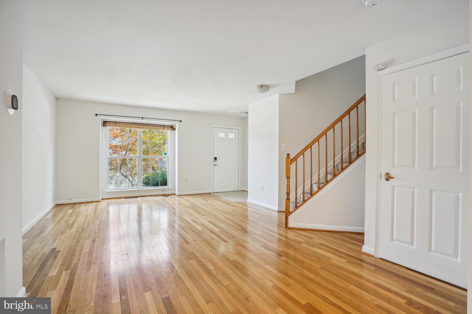 9205 Ridgefield Circle Frederick, MD 21701 - Photo 2 of 19 wooden floor in an empty room with a window