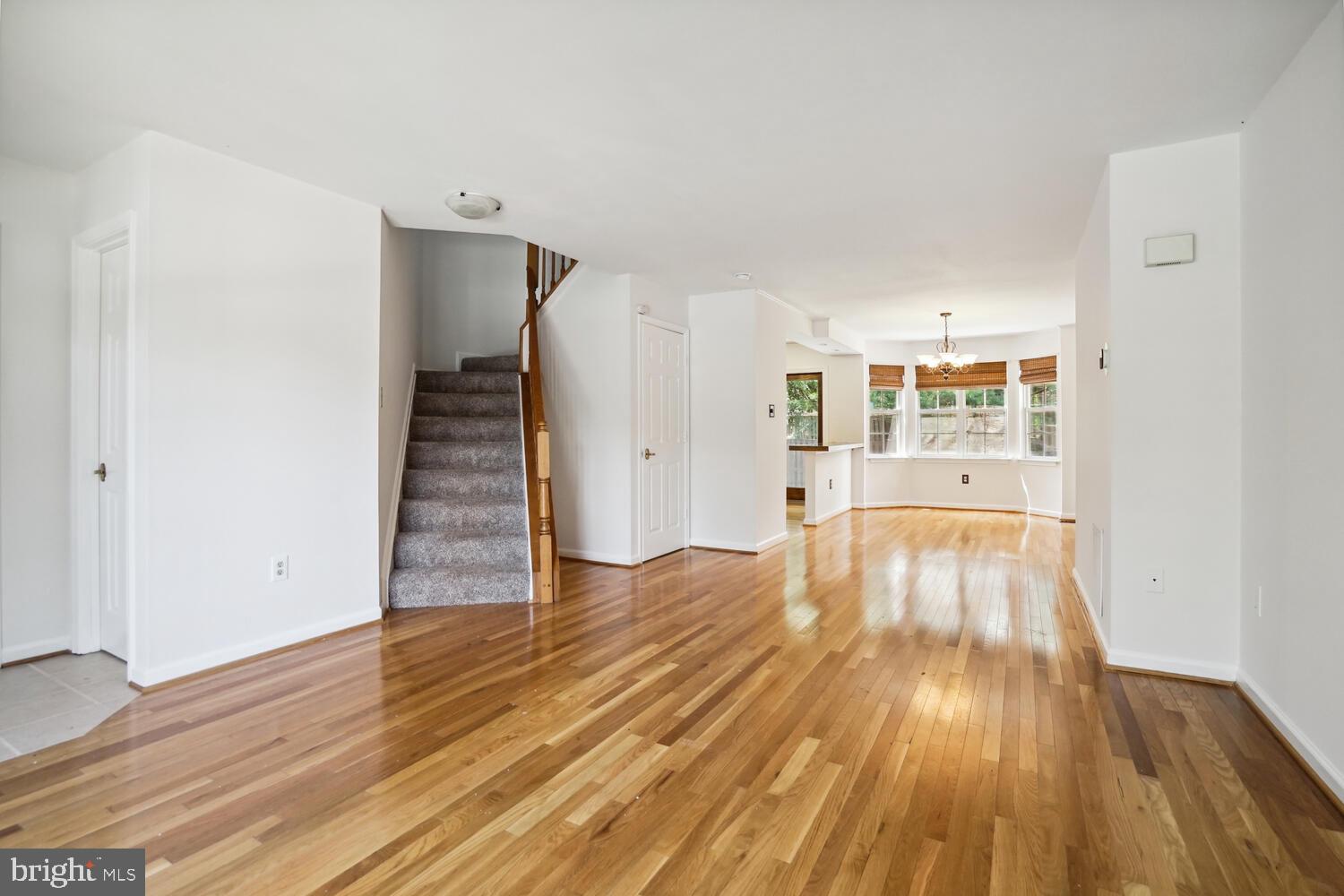 9205 Ridgefield Circle Frederick, MD 21701 - Photo 3 of 19 wooden floor in an empty room with a window